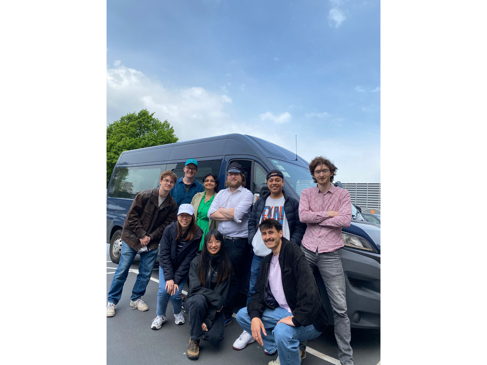 A group of people in front of a bus