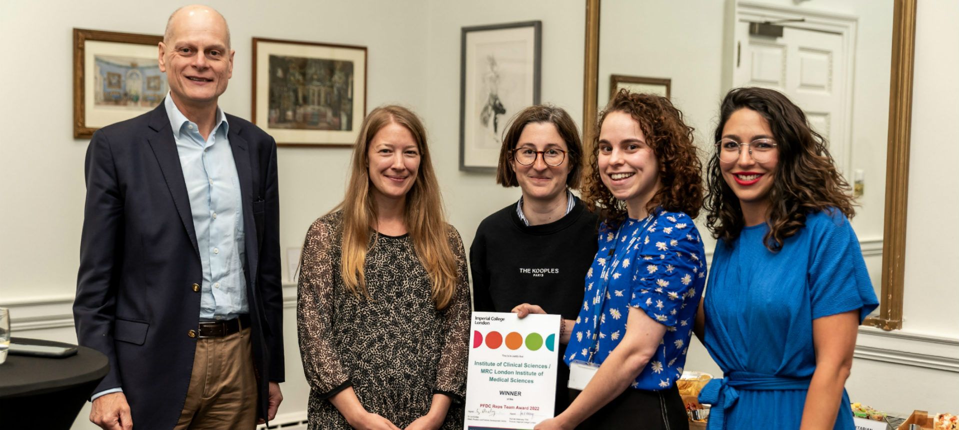 The Institute of Clinical Sciences team receiving their certificate from the Provost