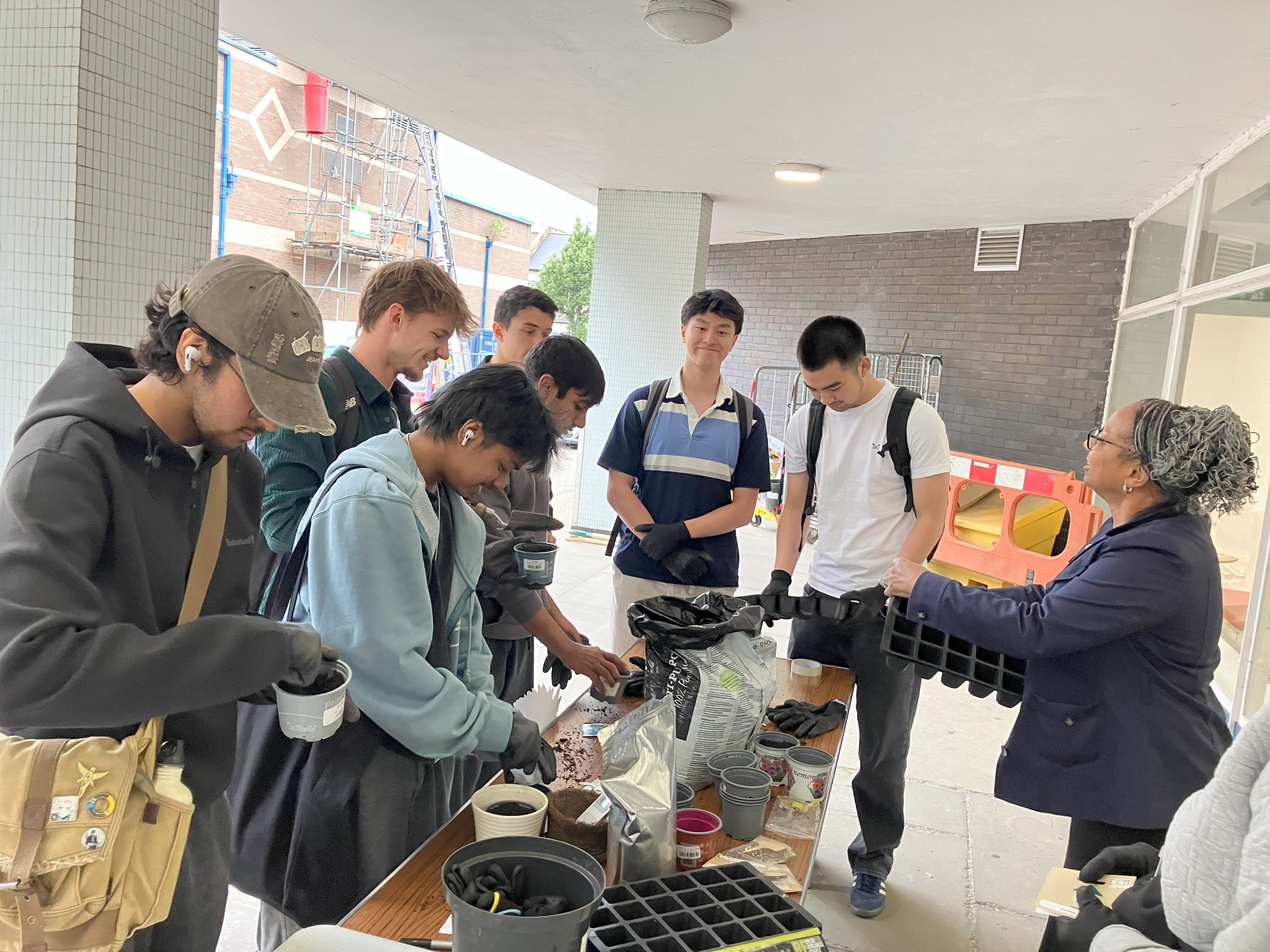 Photo of students taking part in a seed planting event at Charring Cross