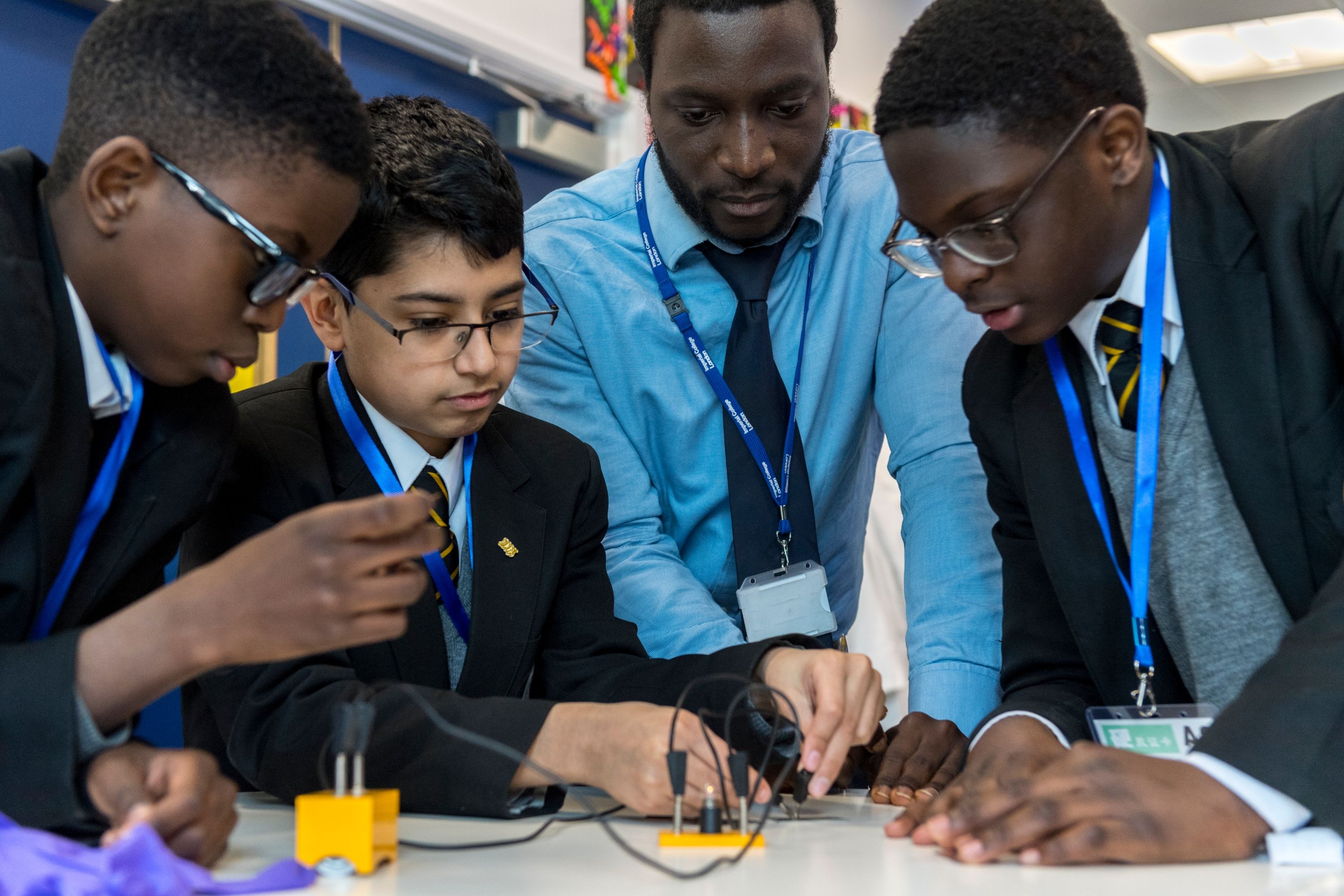 Pupils and teacher taking part in a science workshop in the Reach Out Lab