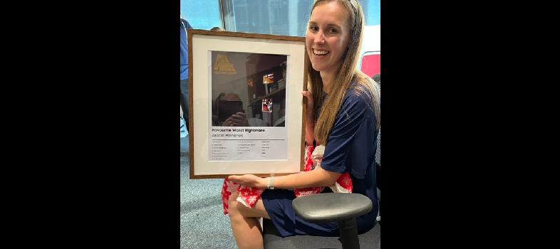 Chloe at her viva with her new arctic monkeys poster