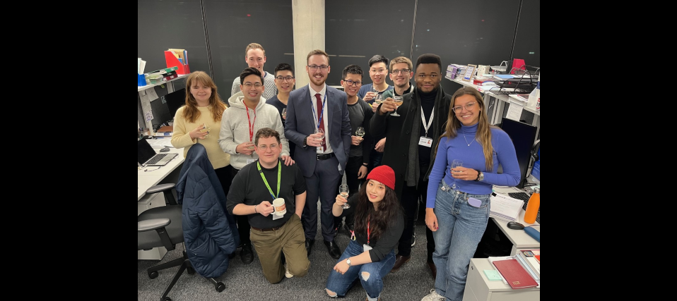 Brad celebrating with the Long Group after a very successful viva