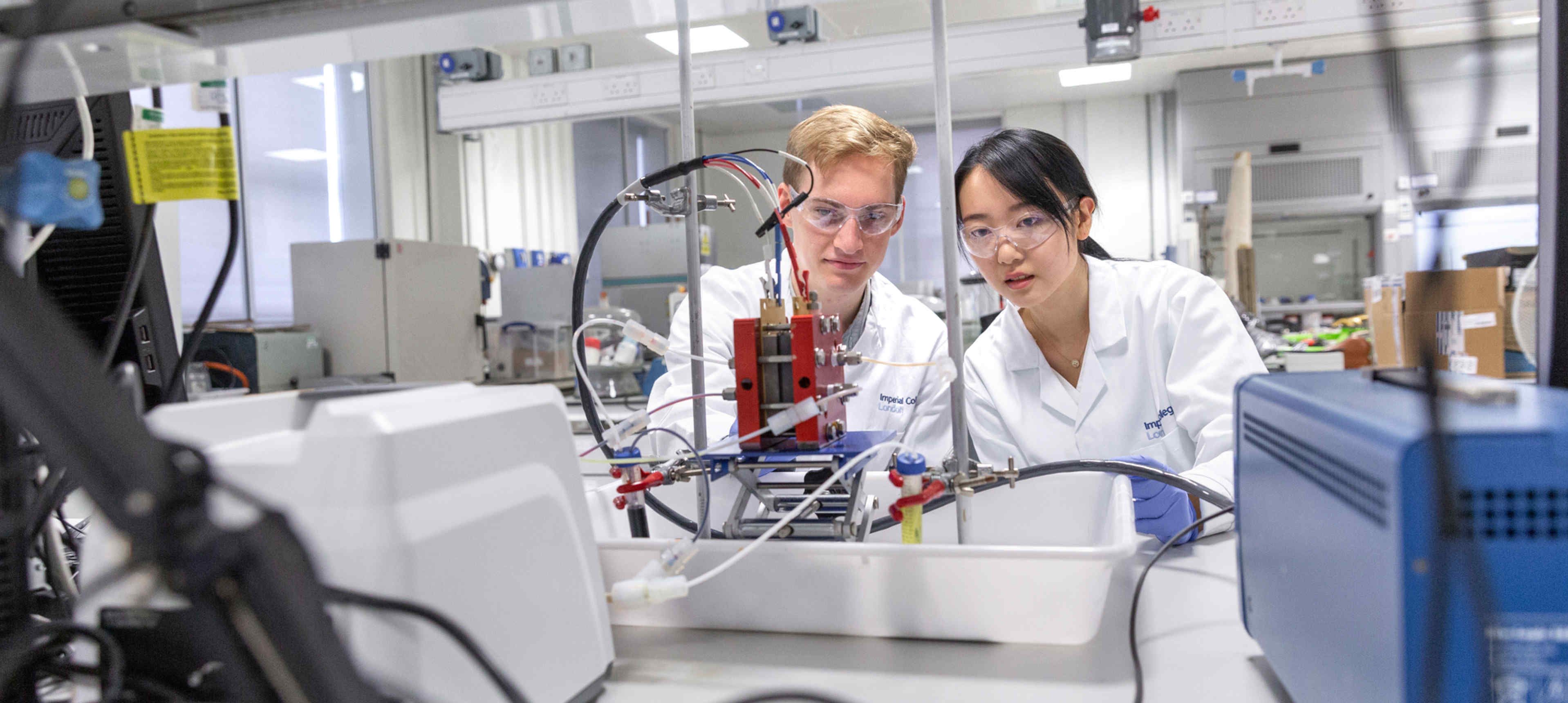 Researchers in an electronics lab