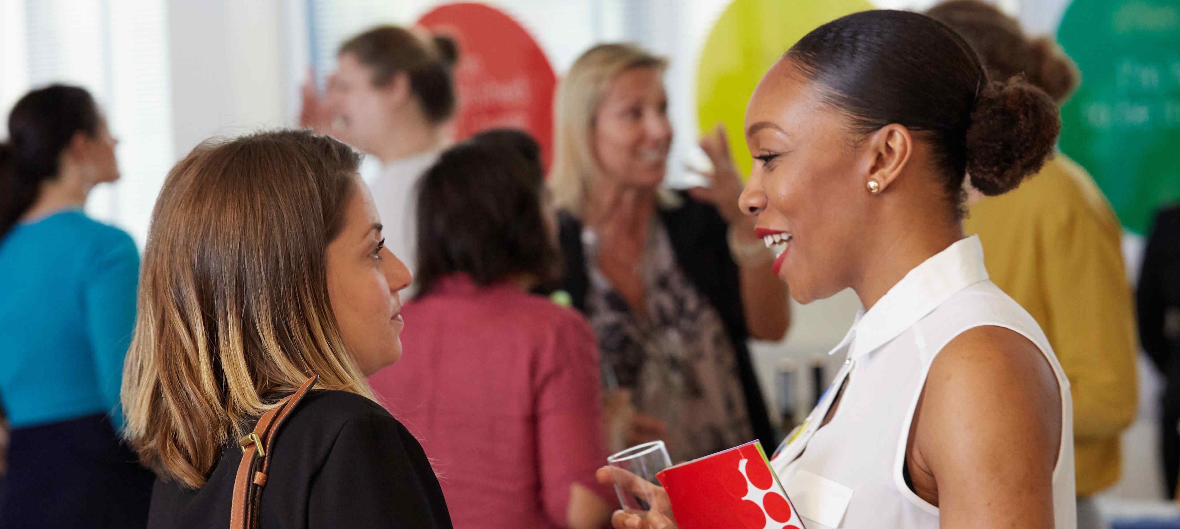 Women talking at the launch event