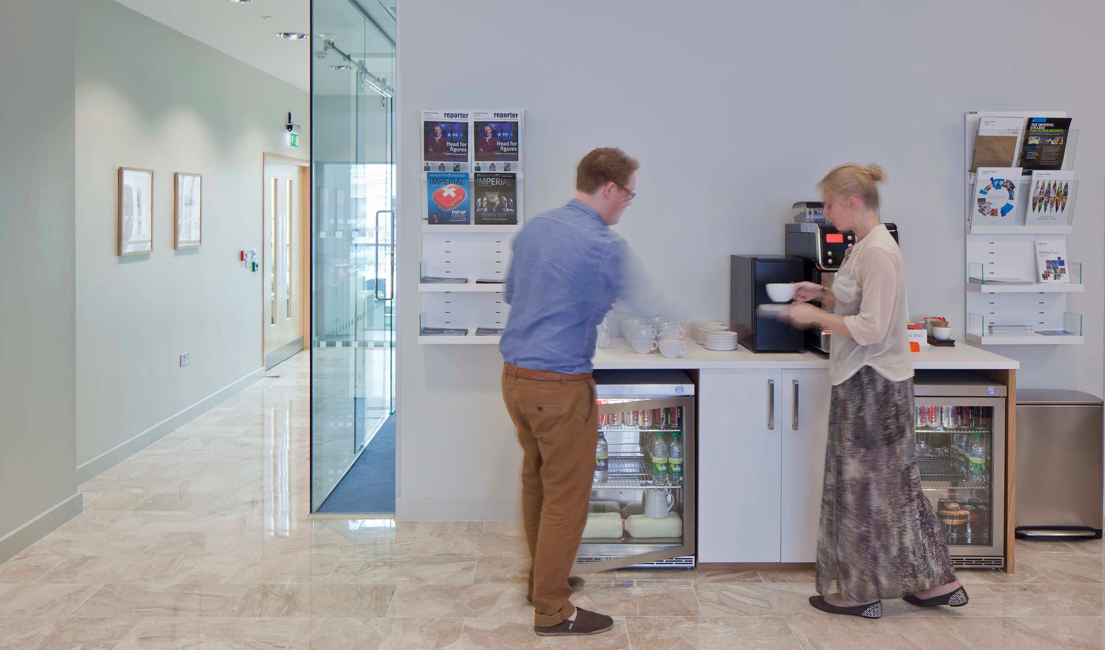 two people in the office kitchen