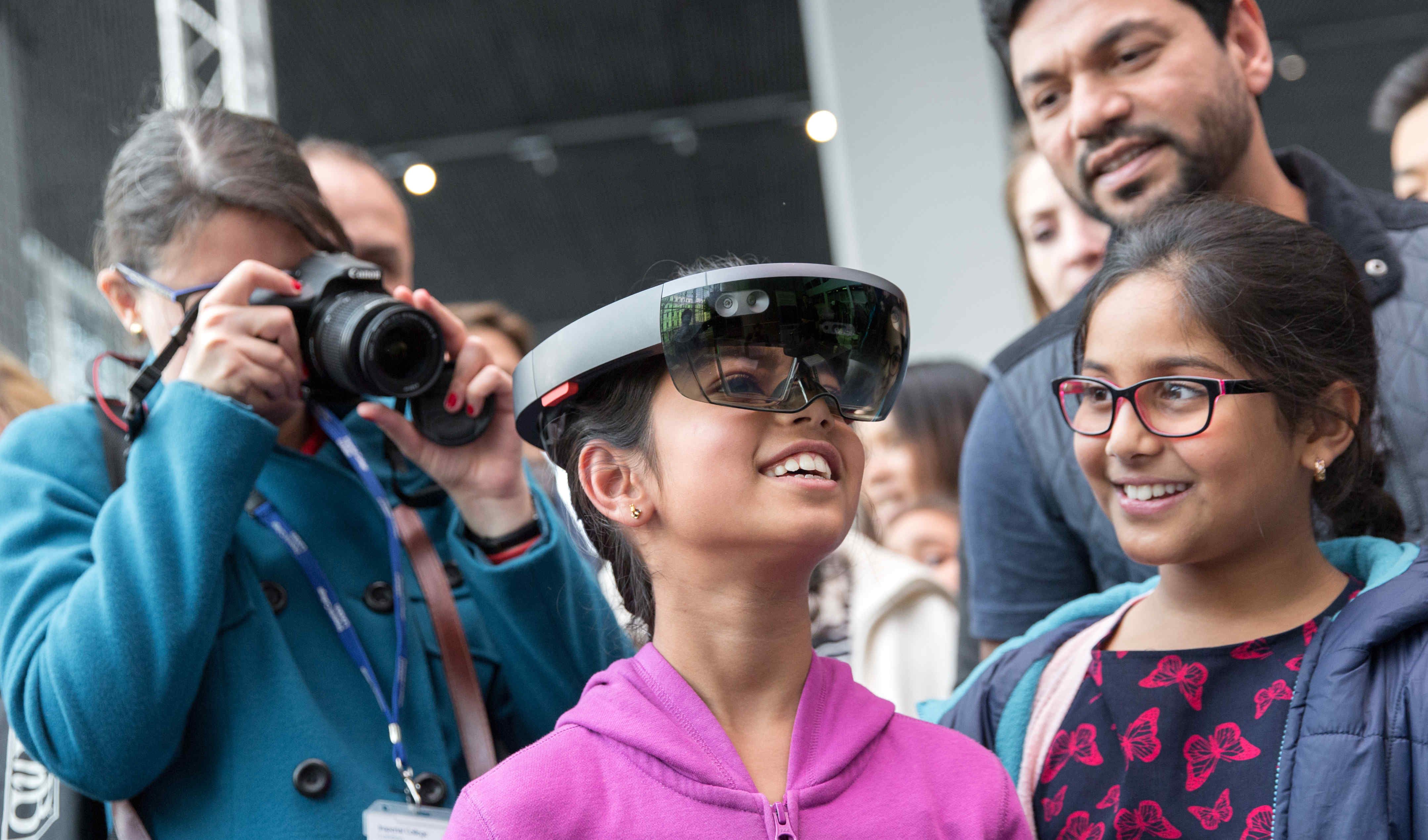 Girl looking through virtual realitygoggles