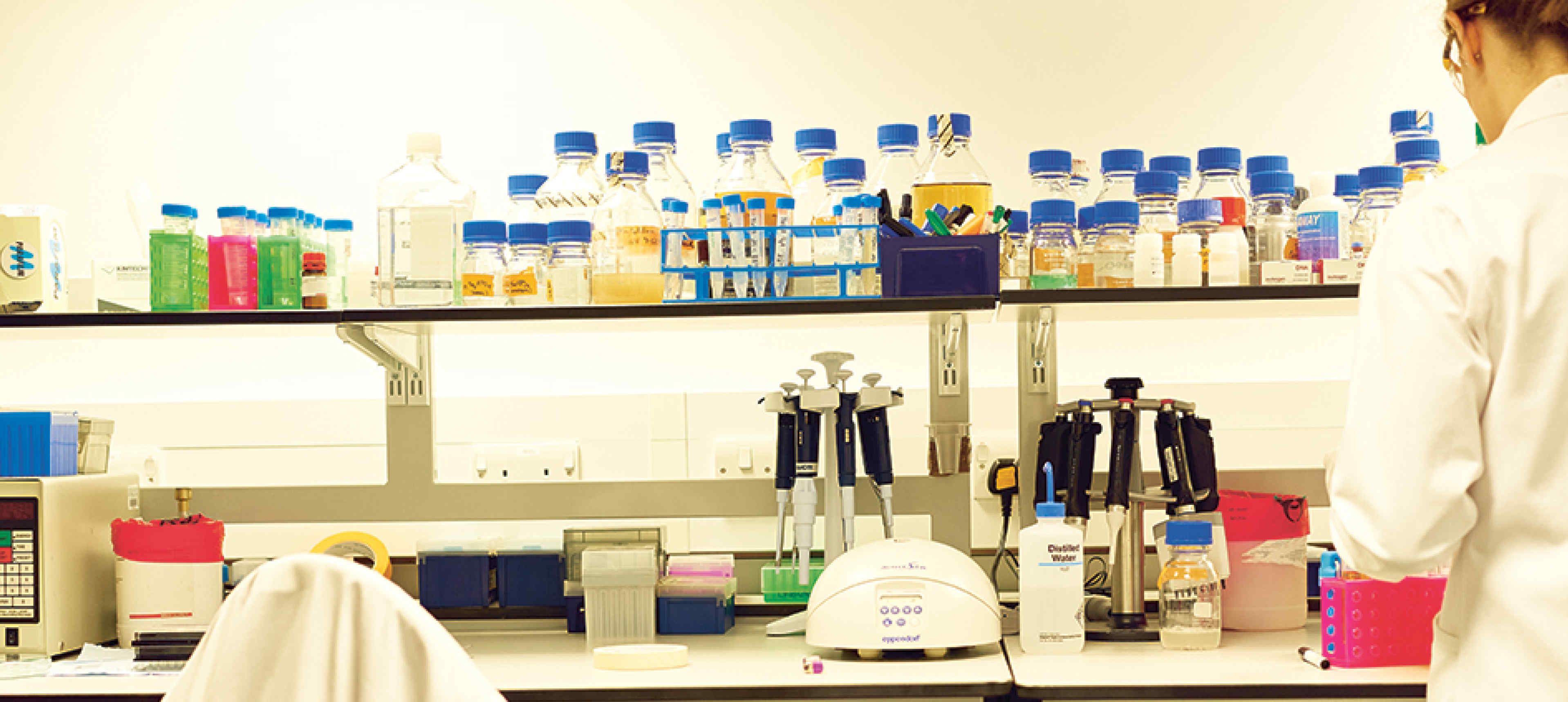 A scientist working at a lab bench