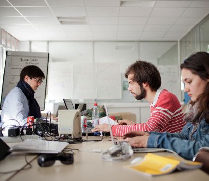 Students working round a table 