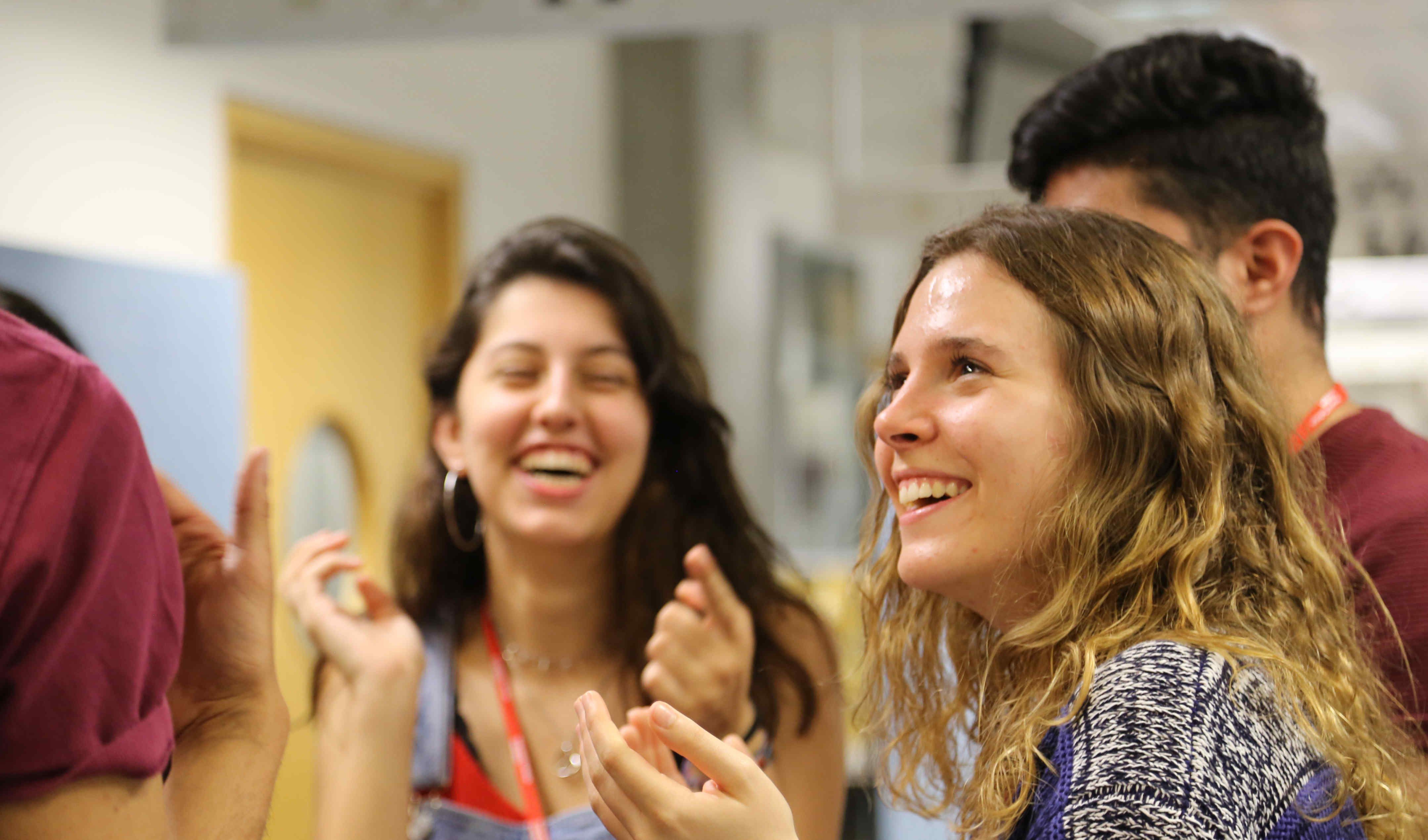 A group of students engaging in a teaching session