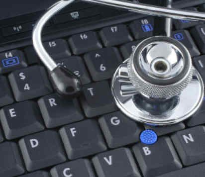 A stethoscope on top of a computer keyboard