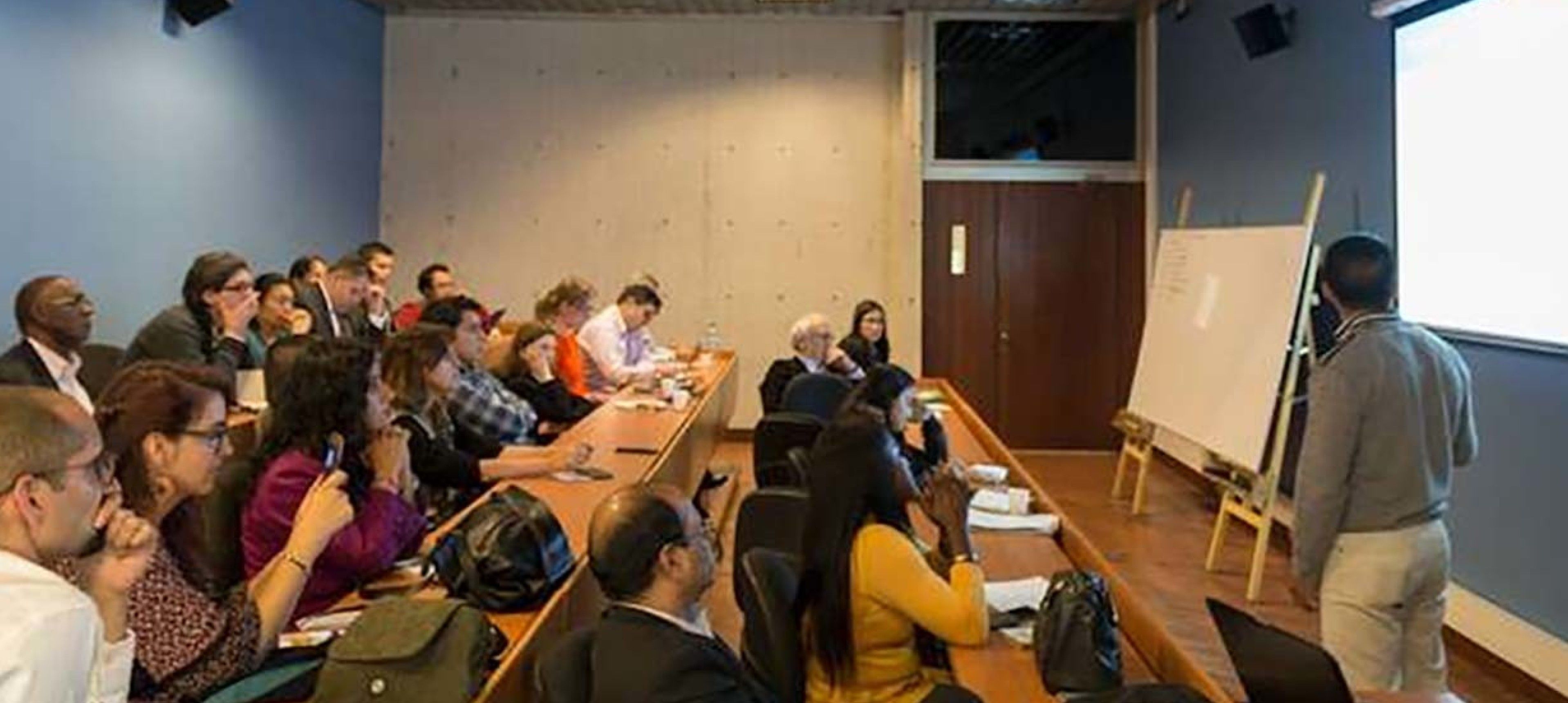 A photo of a lecture presentation taking place at the Colombia Stakeholder Presentations in 2018