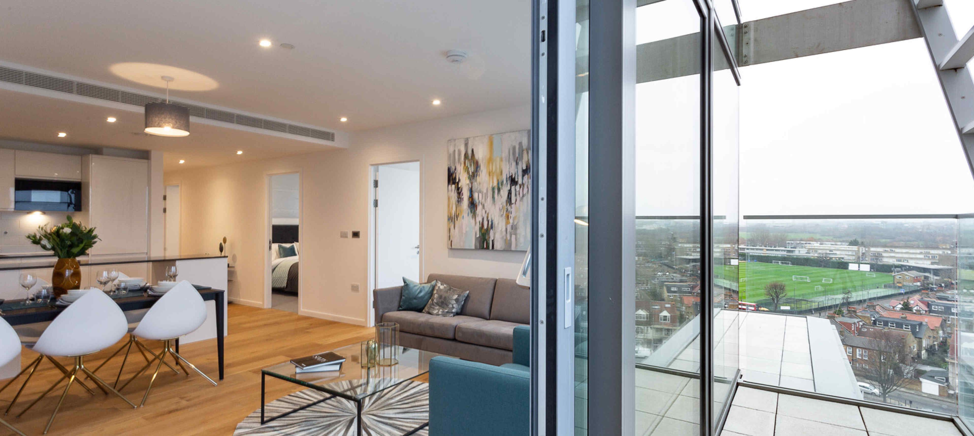 Spacious balcony with sliding glass doors