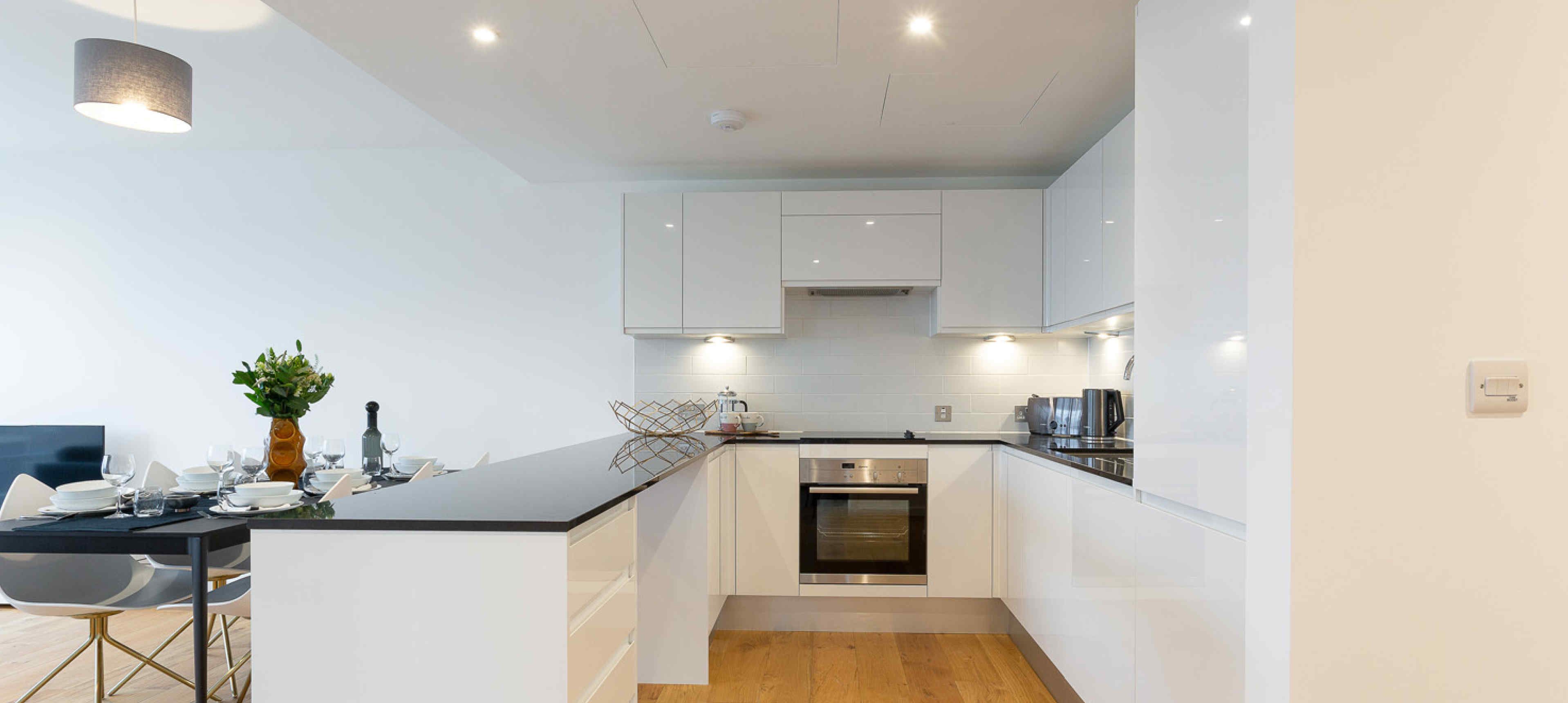 Open plan kitchen with integrated appliances