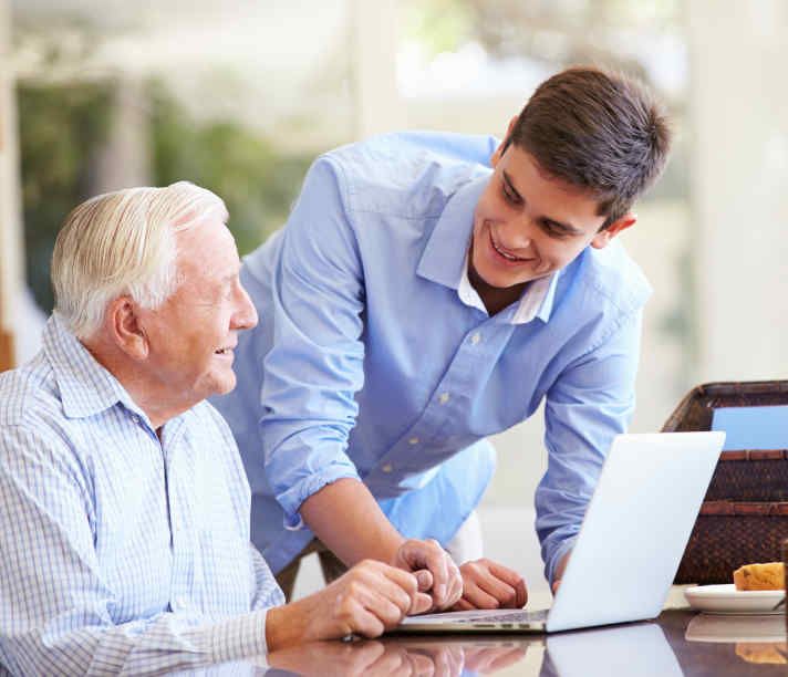 Young man helping older man