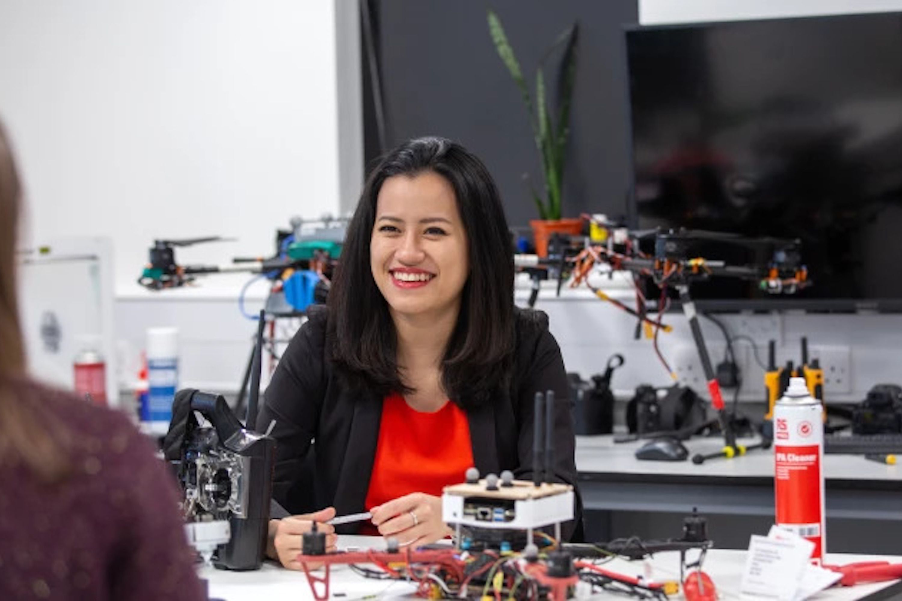 Staff smiling with drone equipment