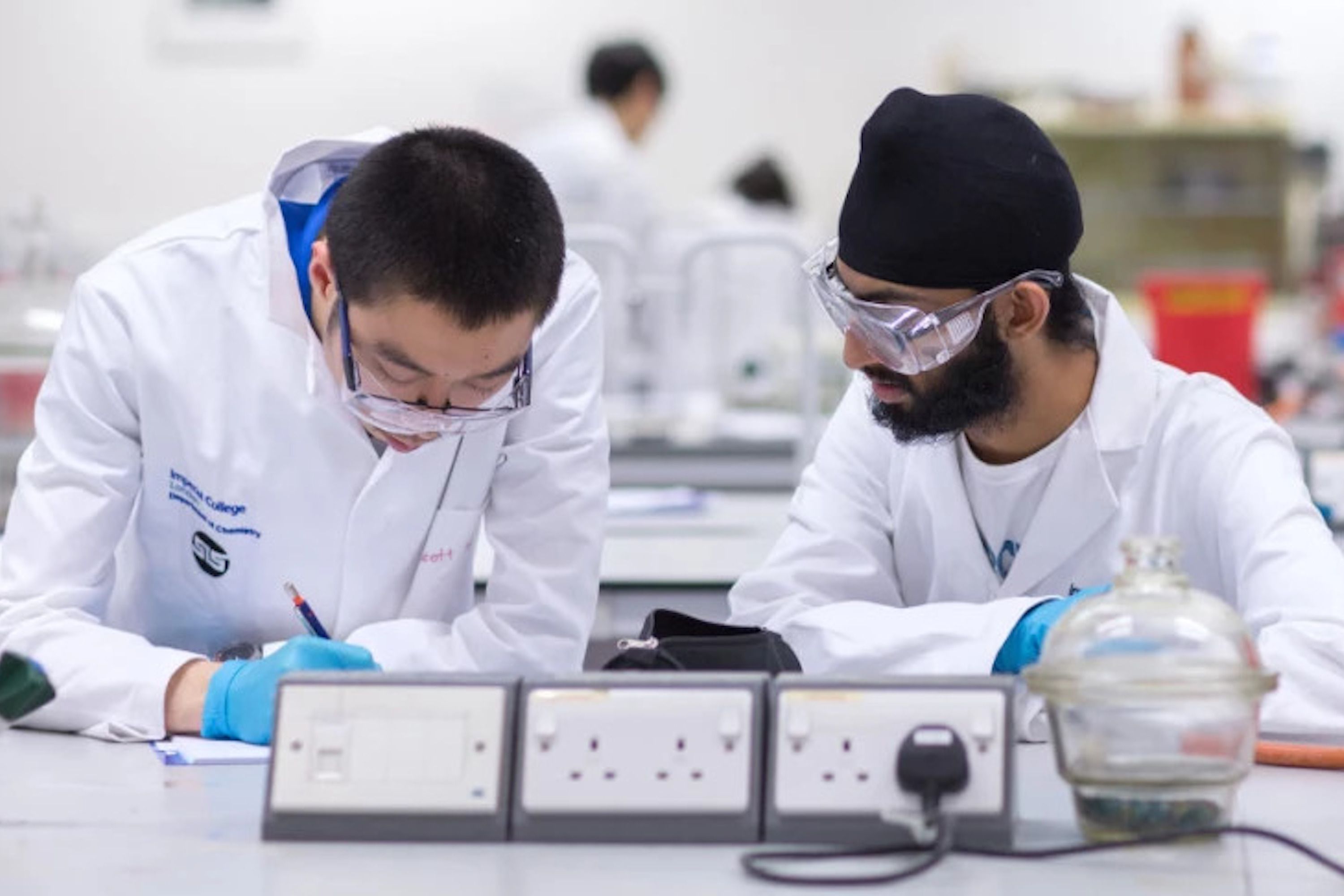 Two students working in lab