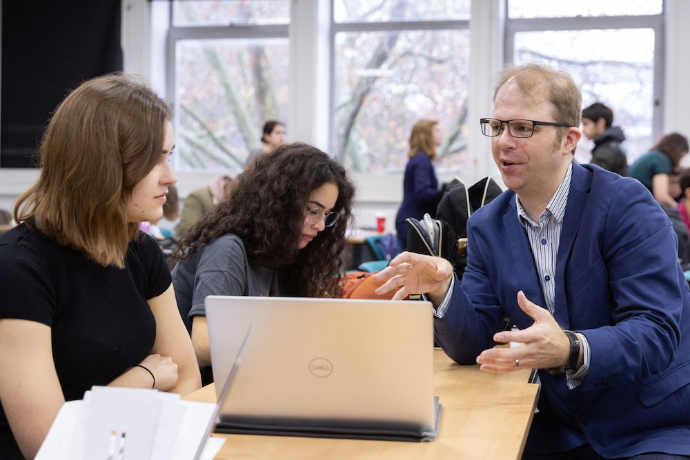 Staff talking with students