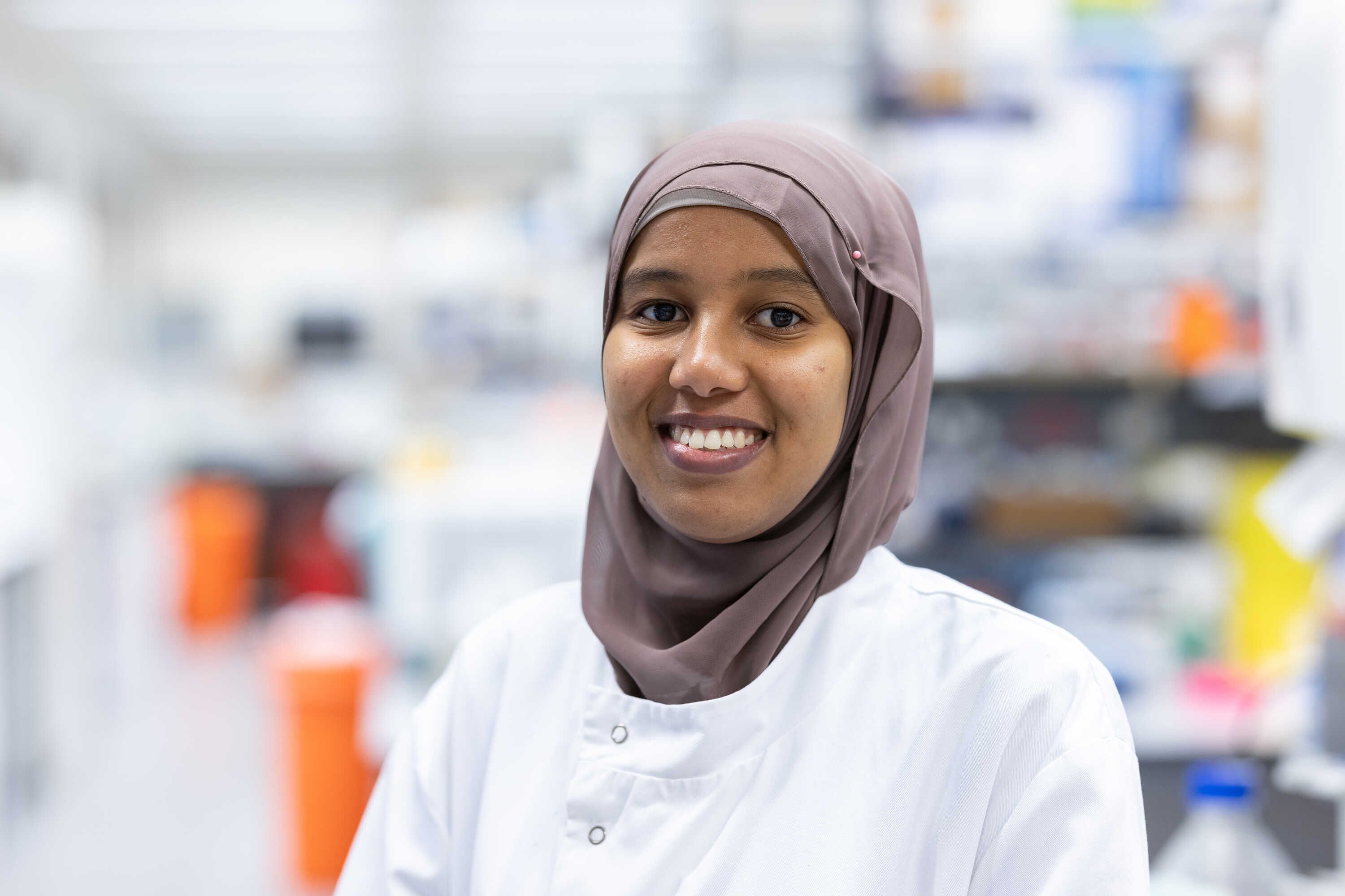 Researcher smiling to camera in the National Heart and Lung Institute Lloyd Lab