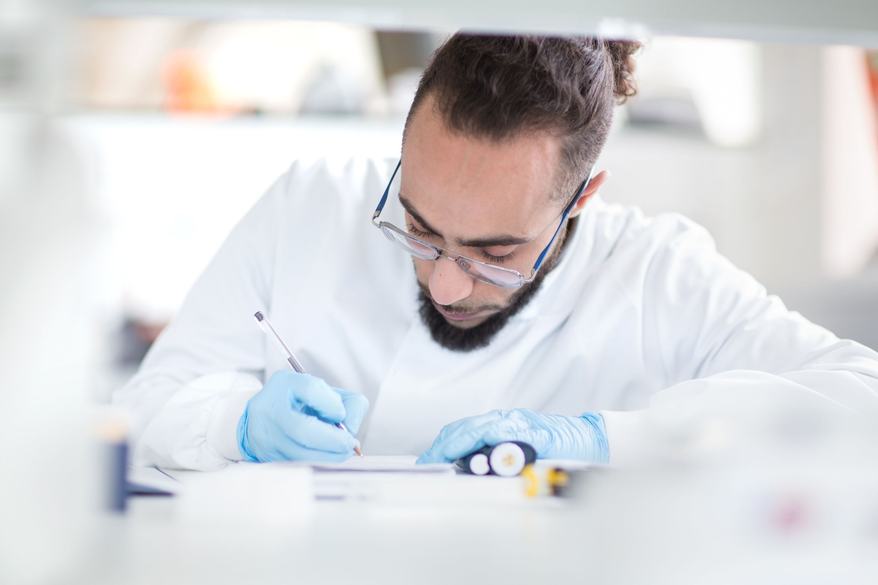 A student writing in the lab