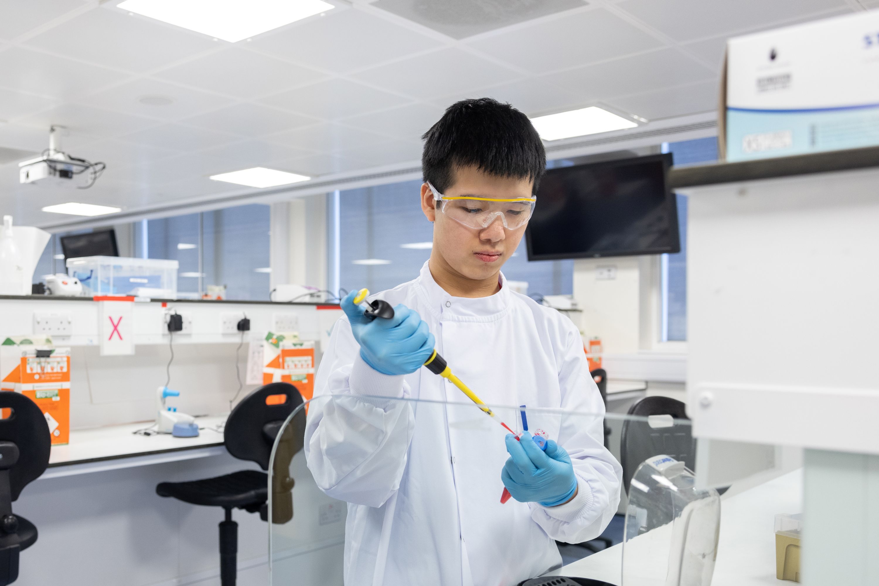 A male student working on a project in the lab