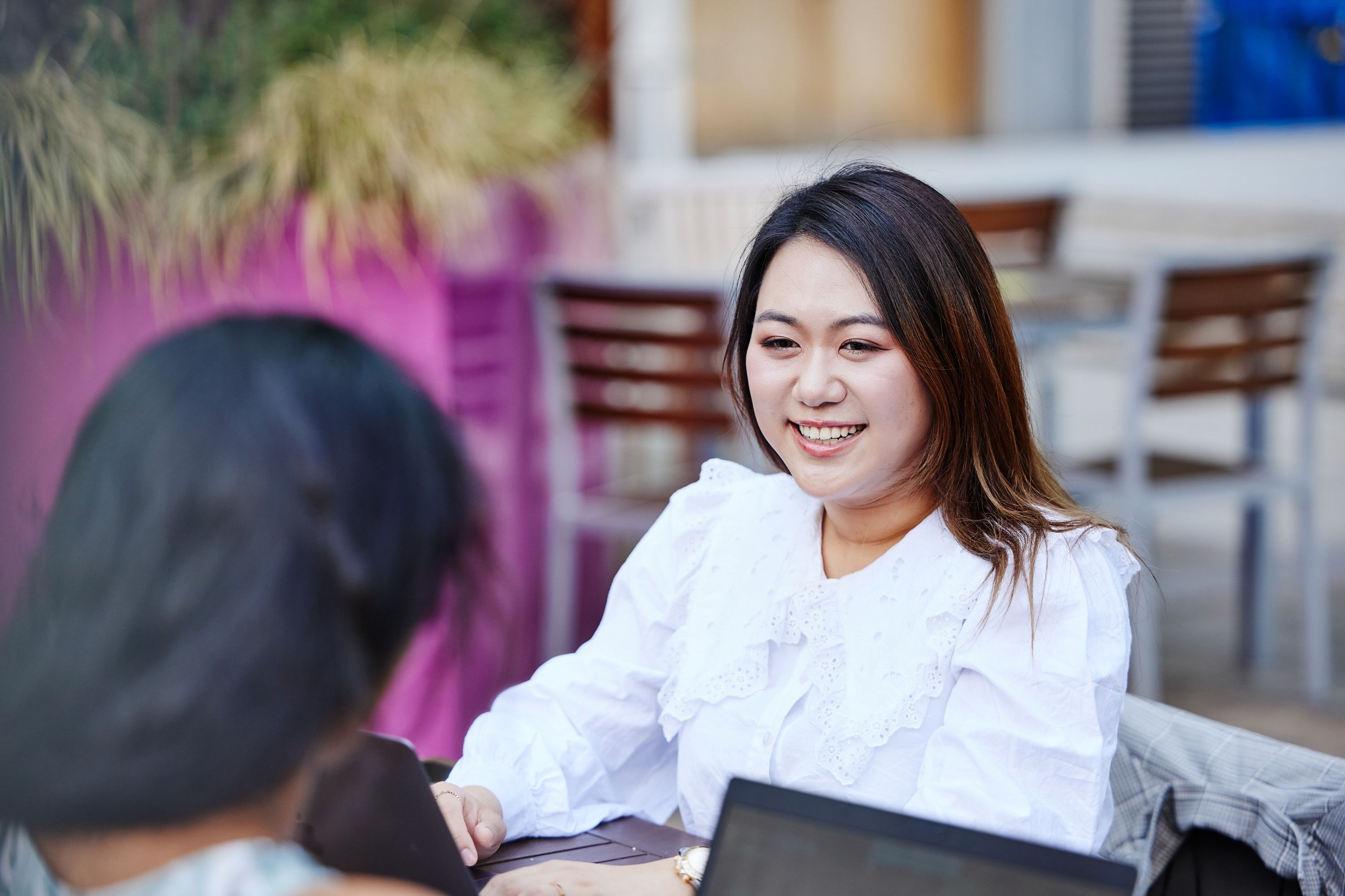 A female student smiling on campus