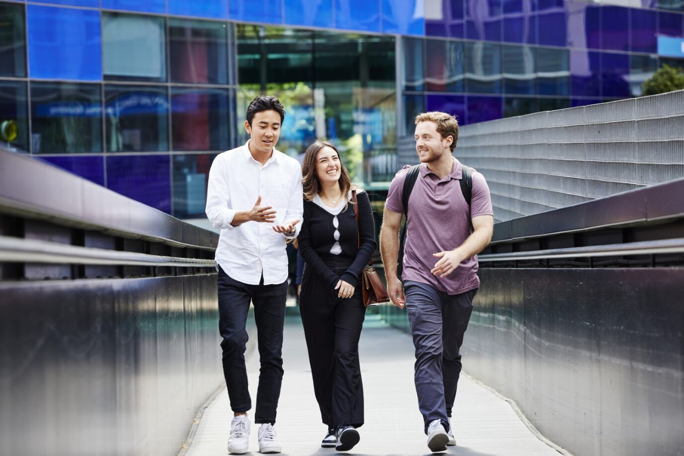 3 students walking up towards Dalby Court