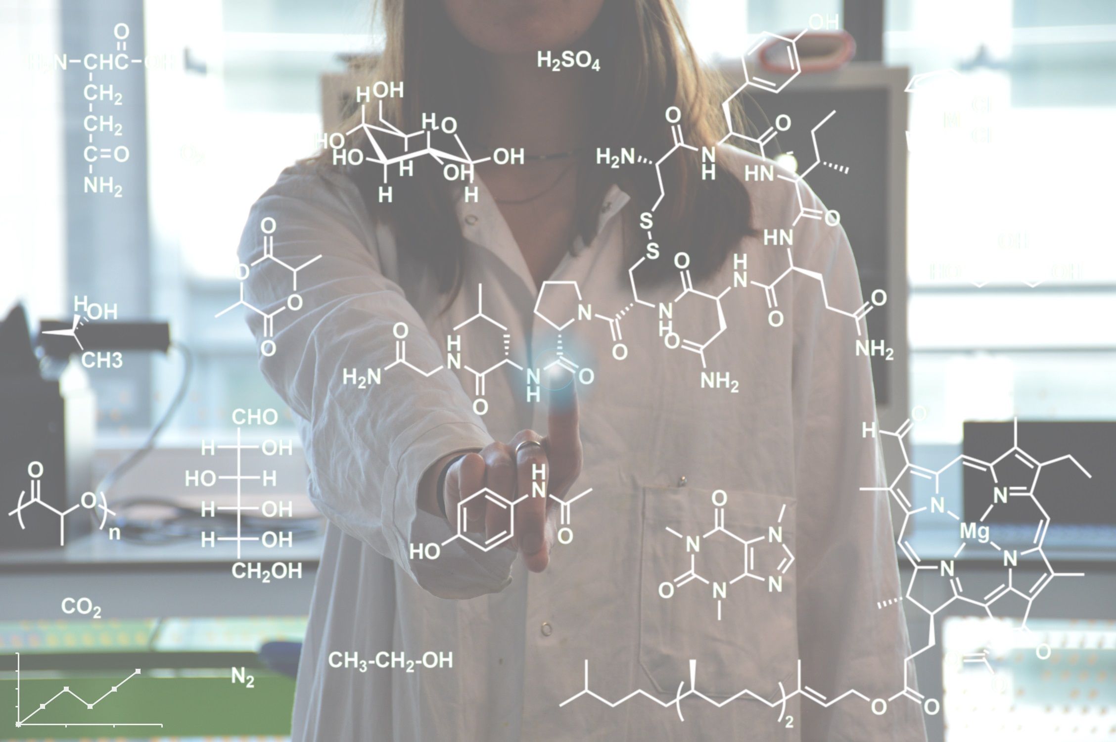 Student pointing to screen with overlay of graphics of molecular structures