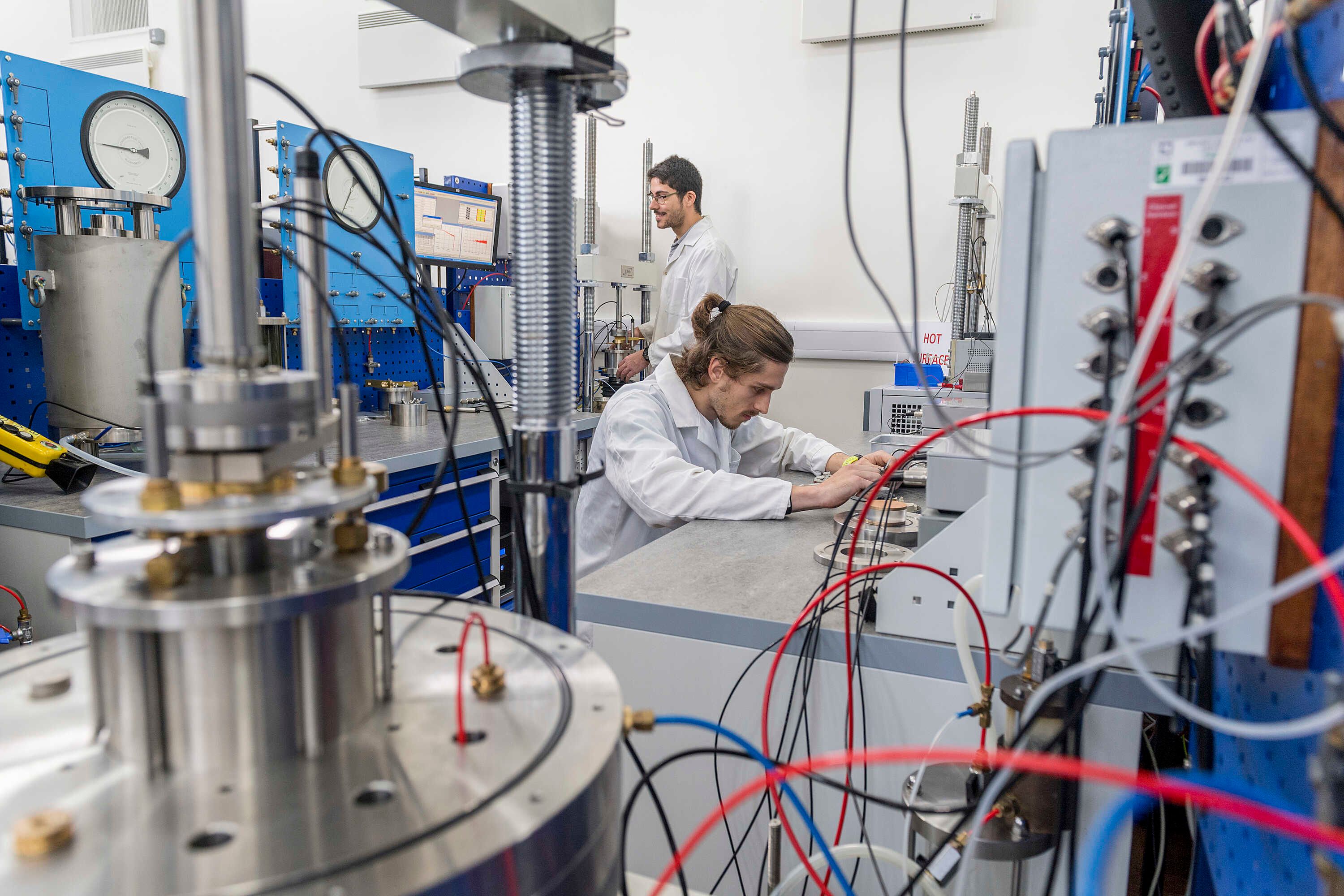 Student examining equipment in the Geotechnical Engineering Laboratories