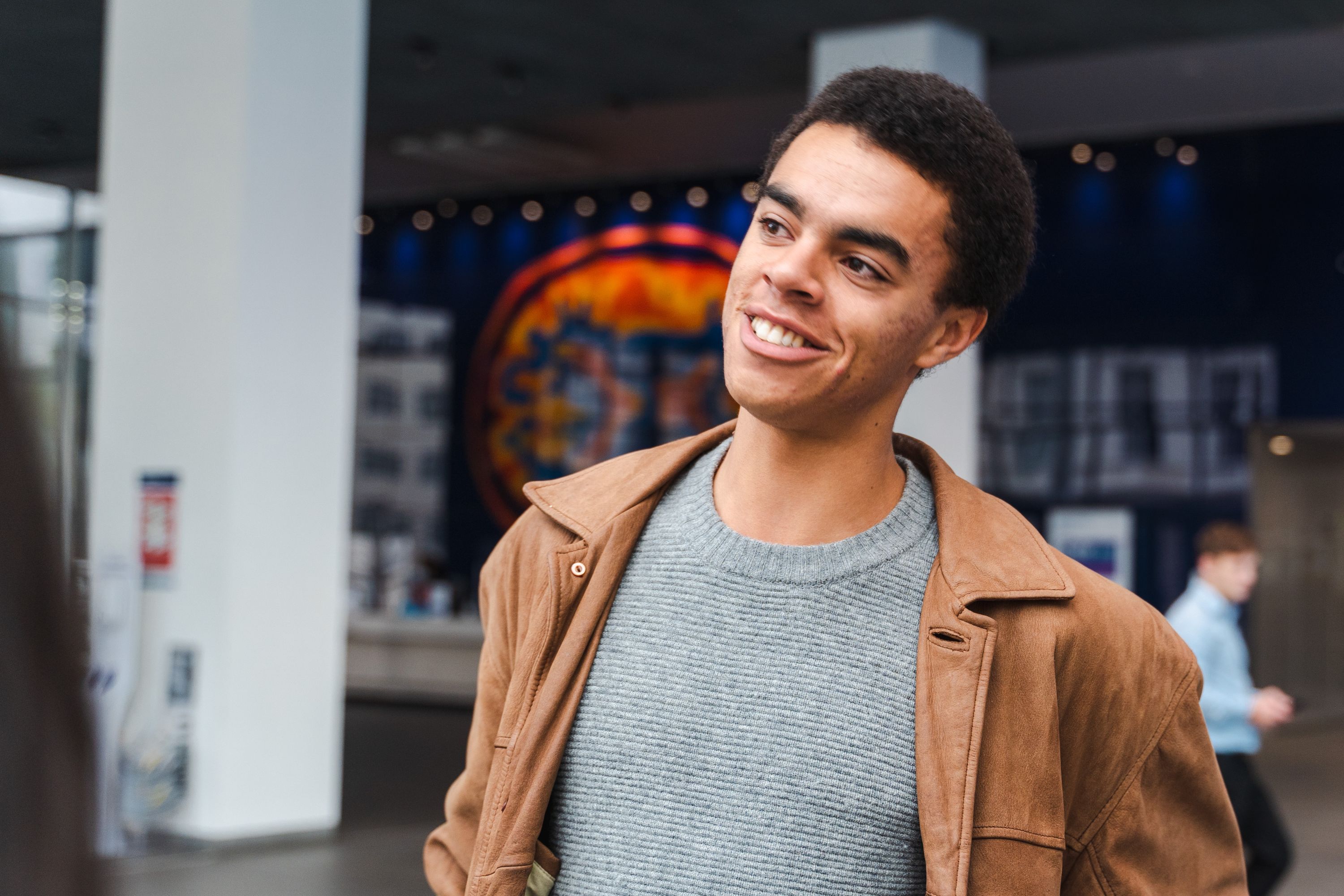 A male student in the atrium