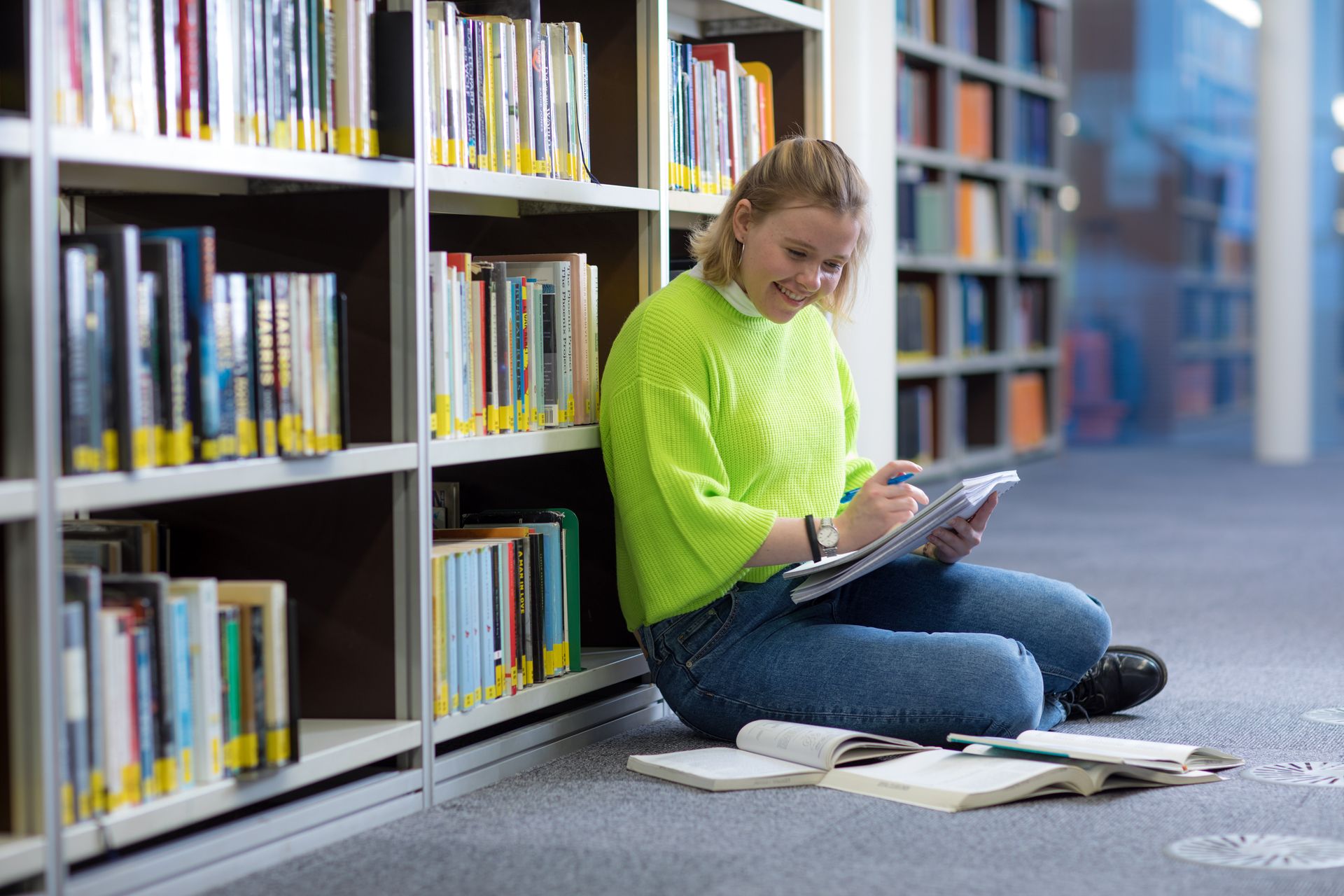 A student working in Imperial's central library