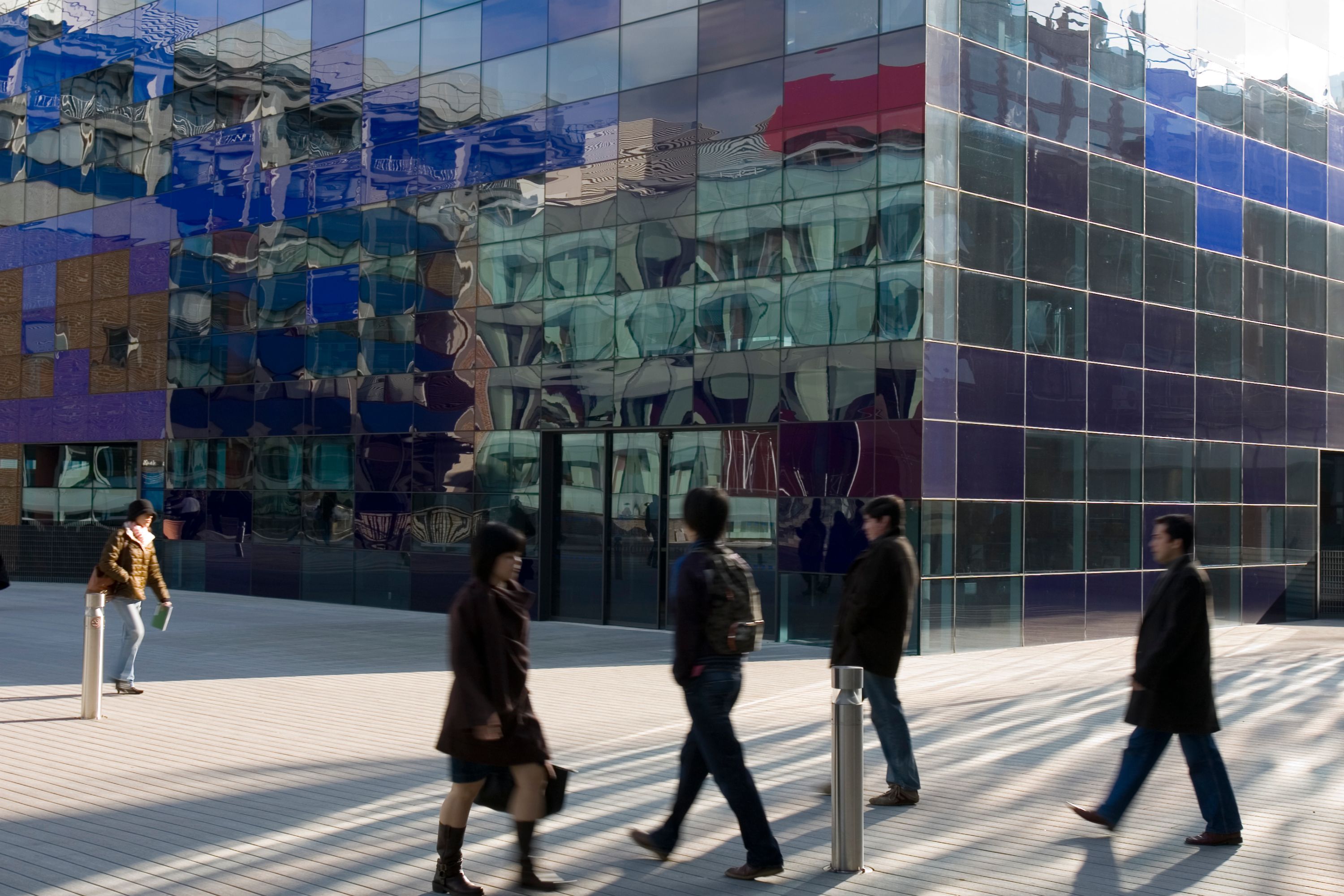 People walking on campus in front of the Faculty Building