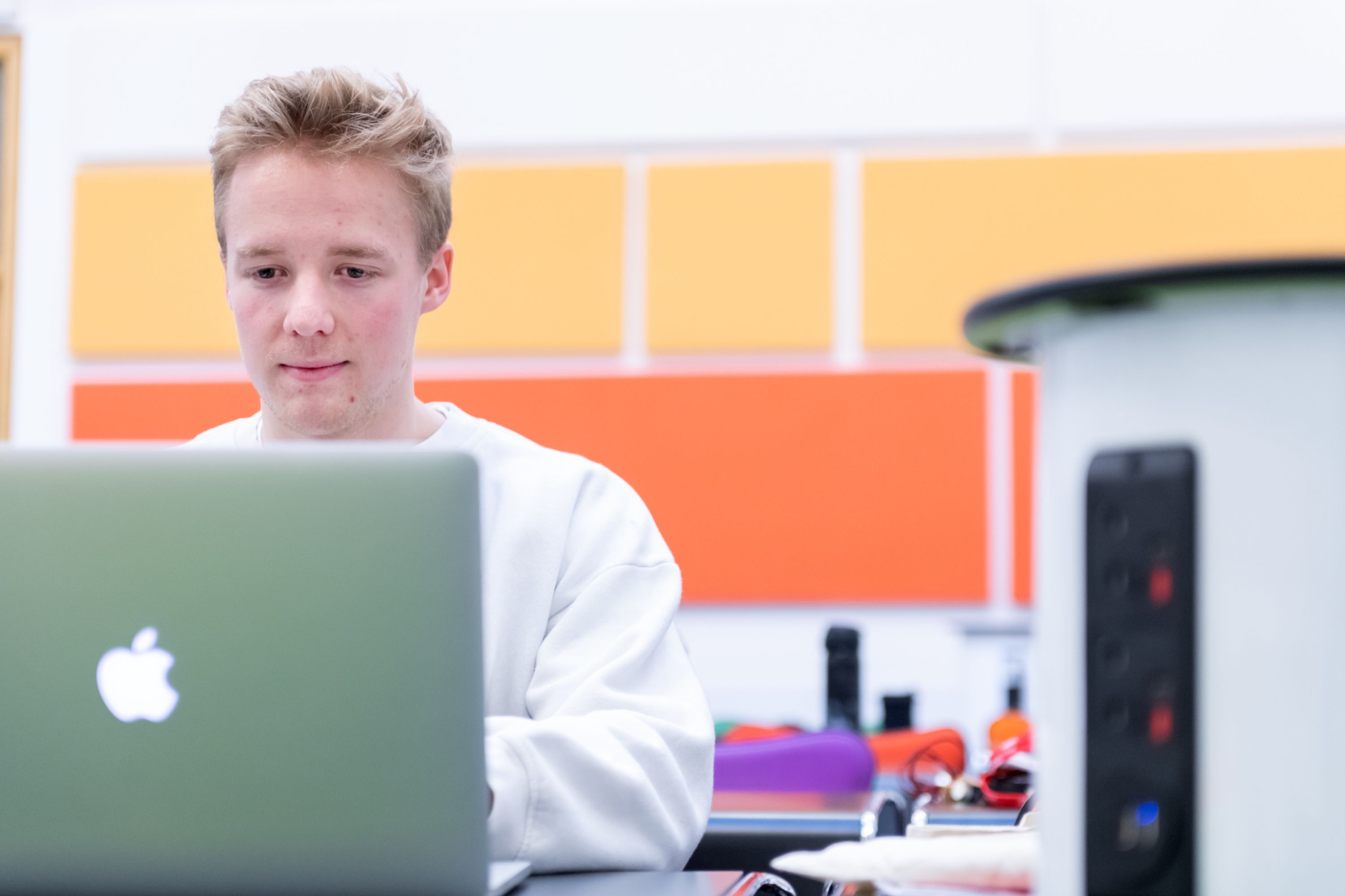 A student sat at his laptop