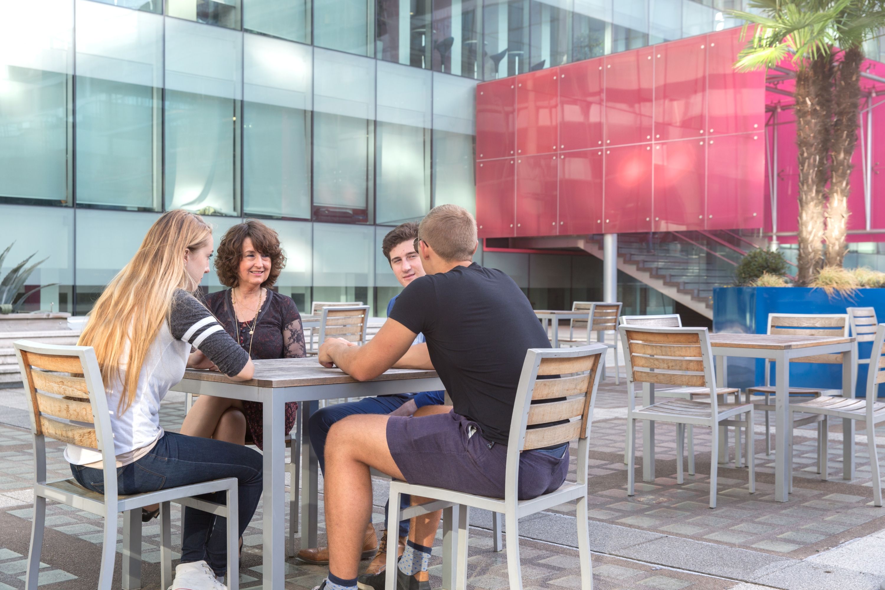 A group sat around a table in Dalby Court