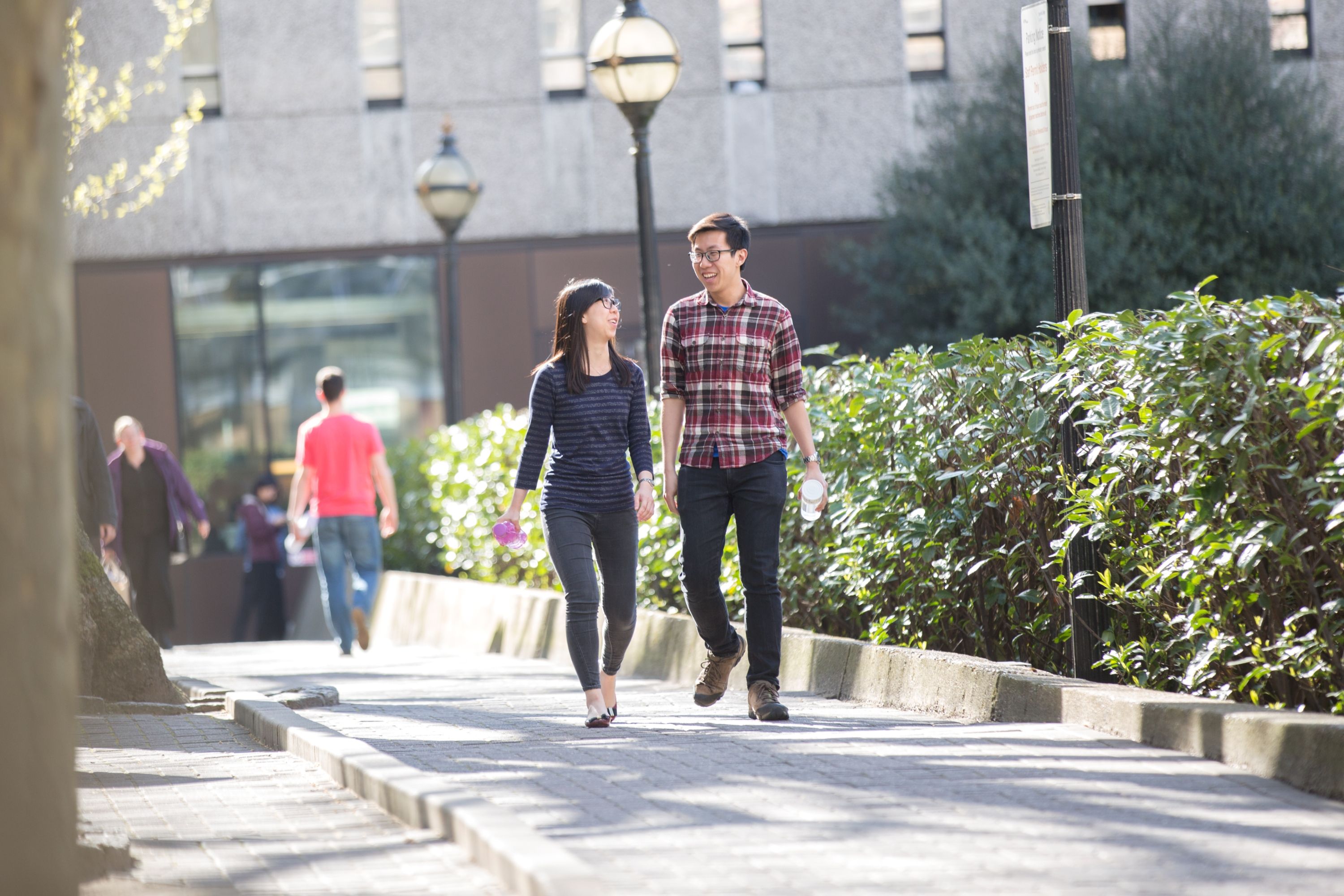 Two students walking on campus