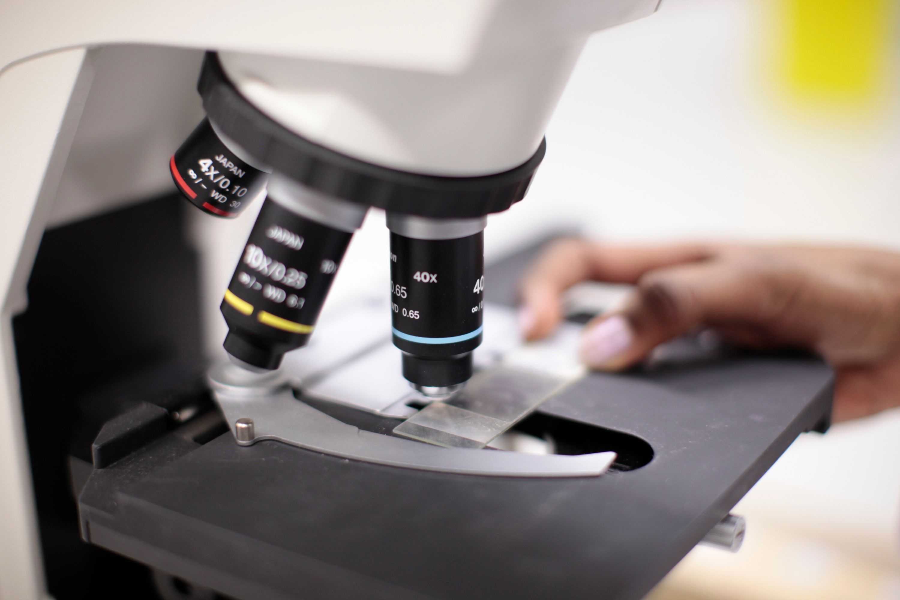 A student looking through a microscope