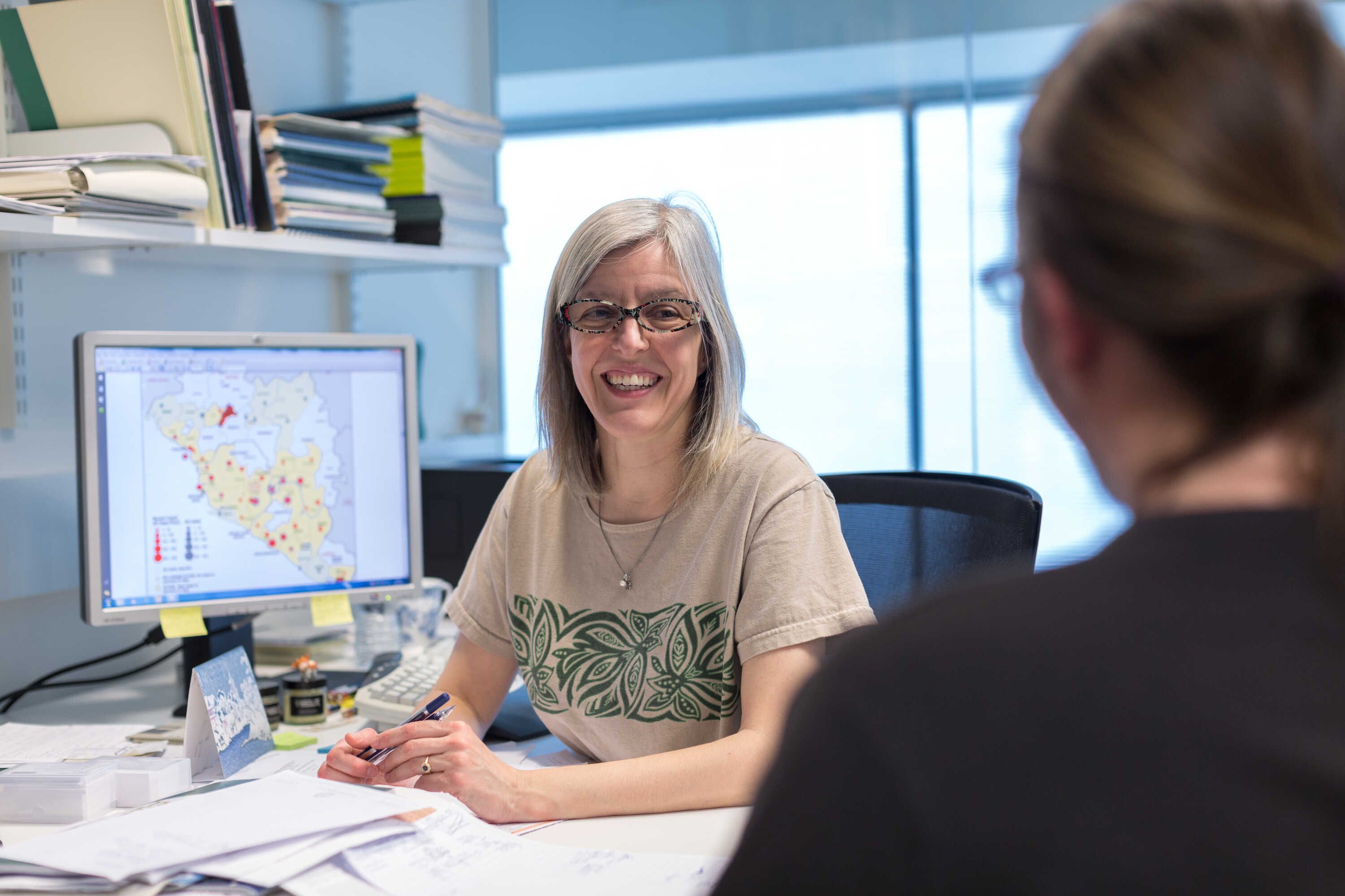 a female gp speaking with a patient