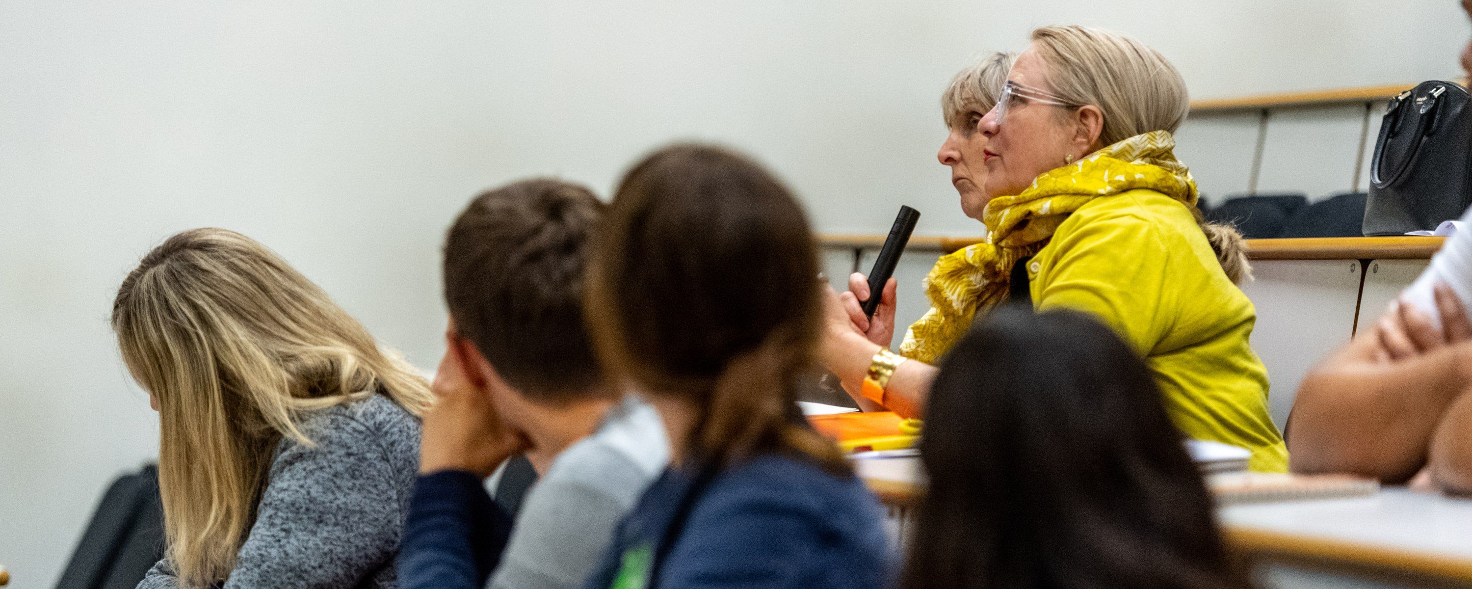 a staff member asking a question