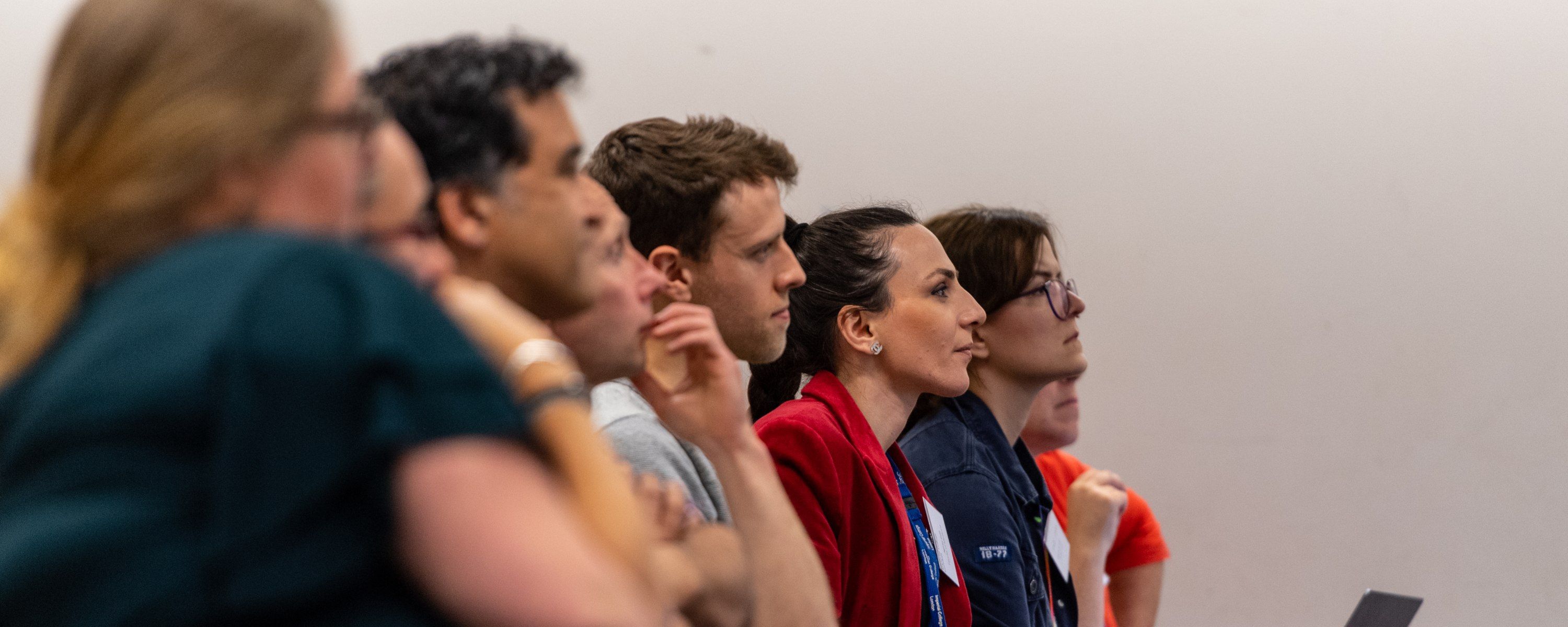 a group of staff listening to a lecture