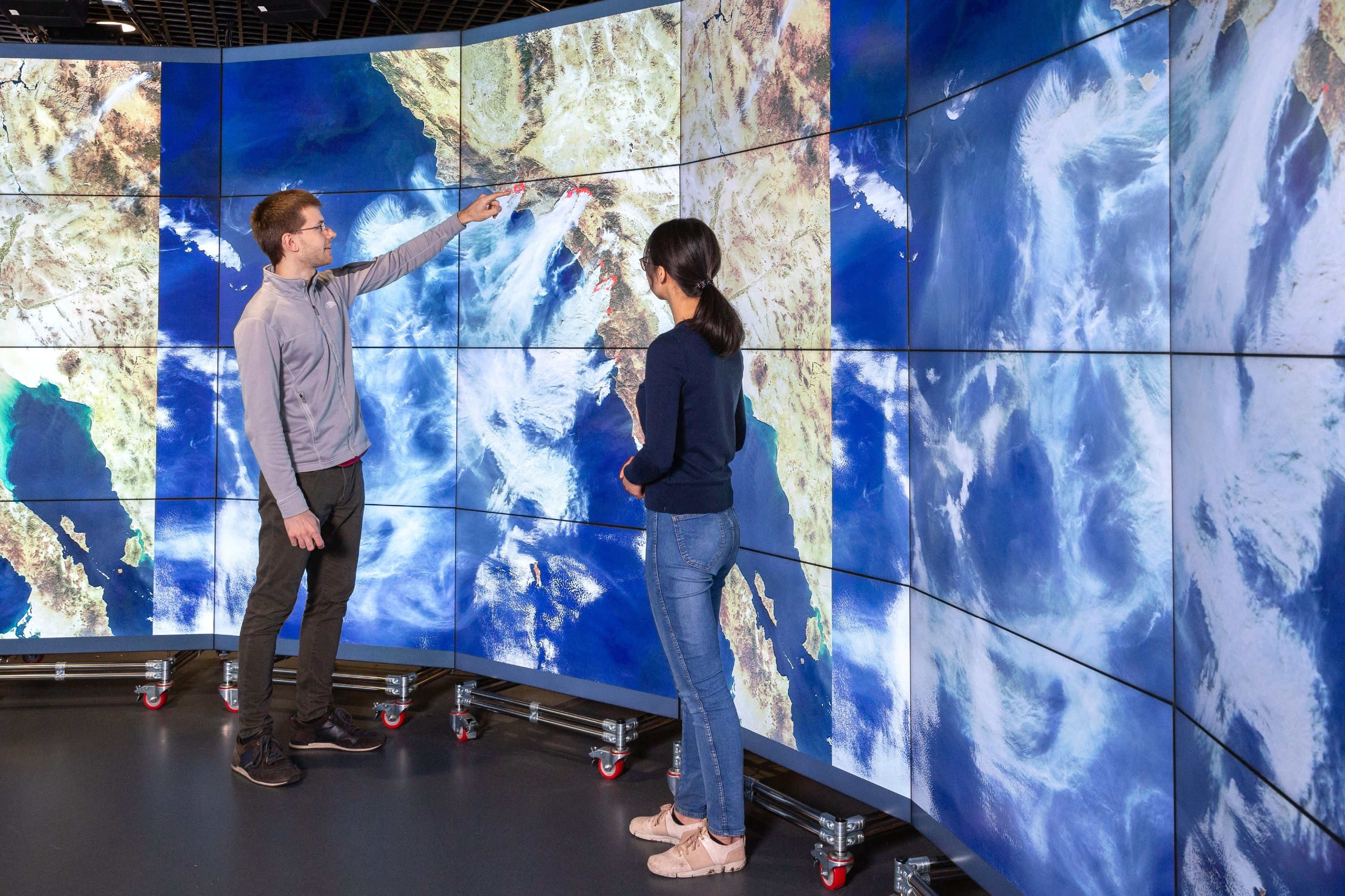 Data science institute big screen with people