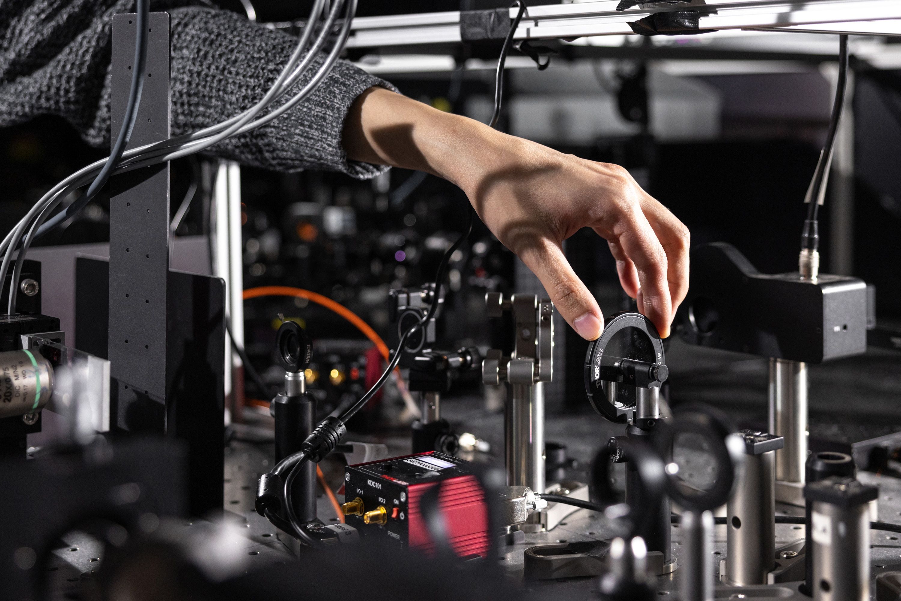 A hand adjusting lab equipment