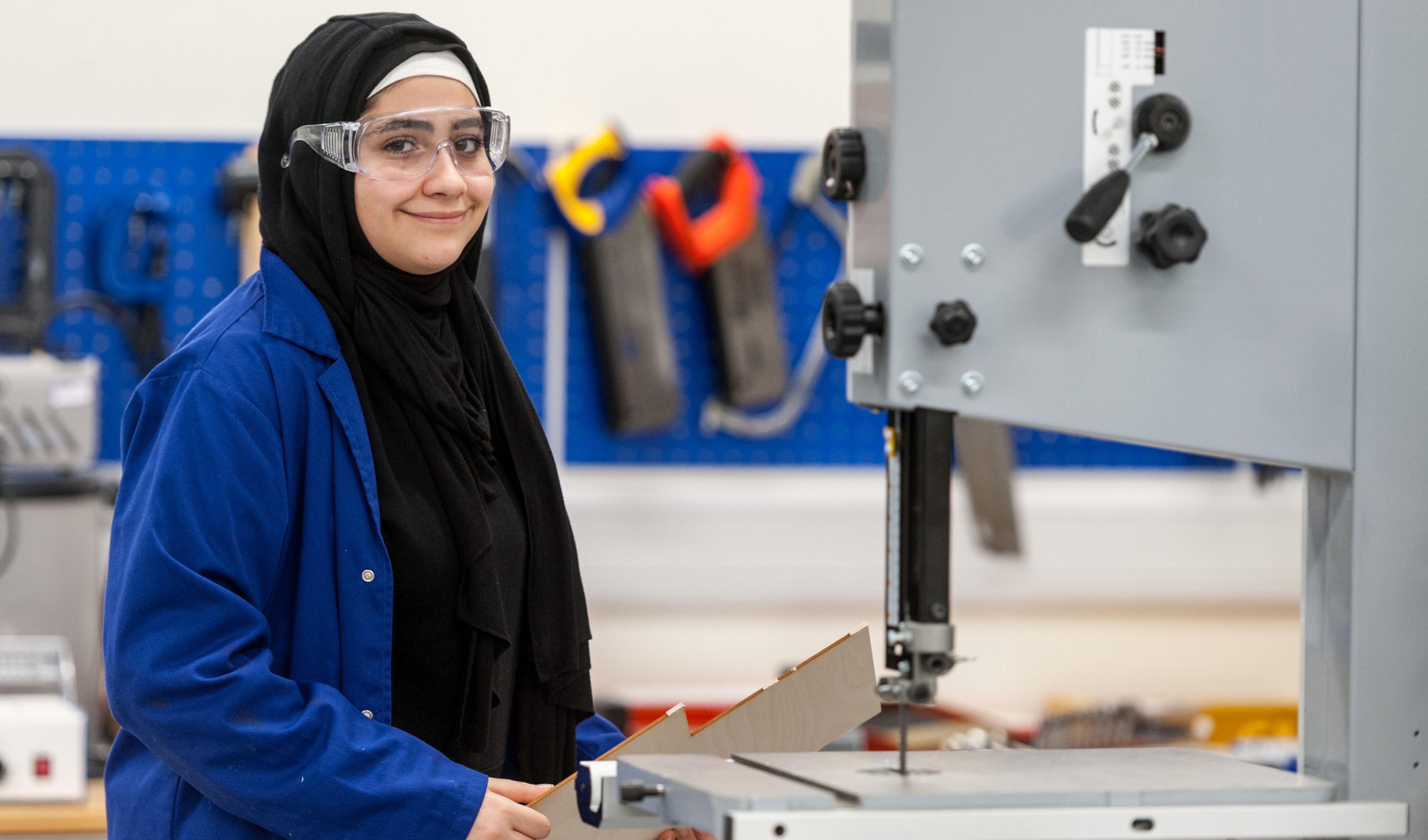 A secondary school student using equipment in the Makerspace.